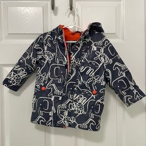 Gender neutral raincoat with animal print